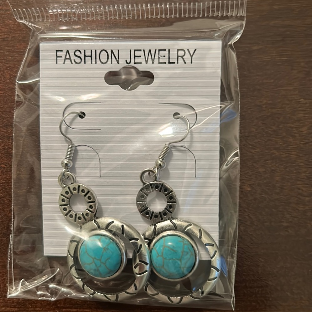 Fashion earrings in silver and turquoise, black and white turquoise color.